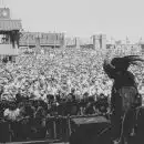 grayscale photo of people on a concert